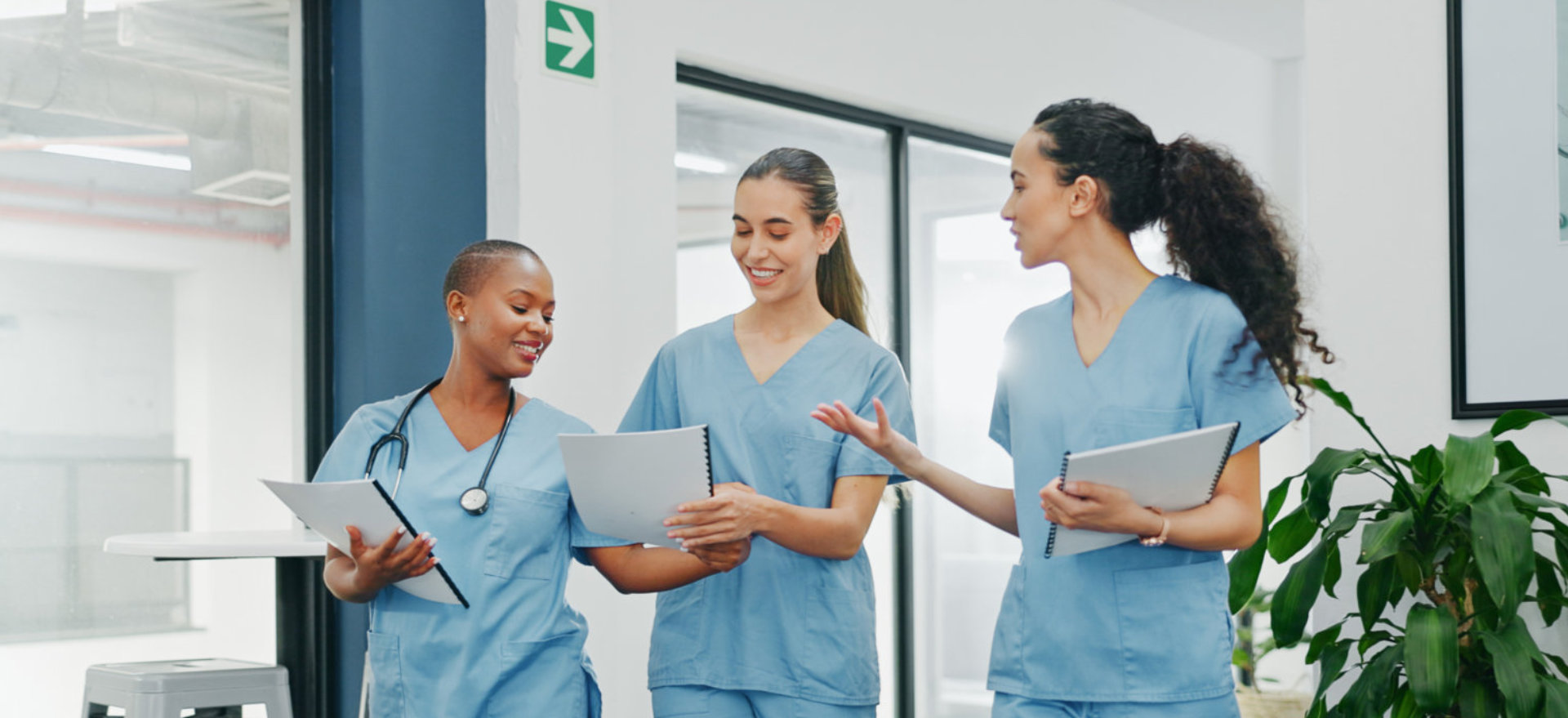 three nurse talking