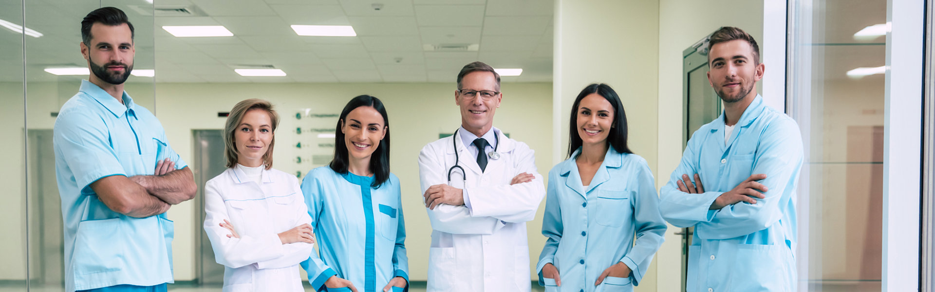 group of medical staff gather on the hallway